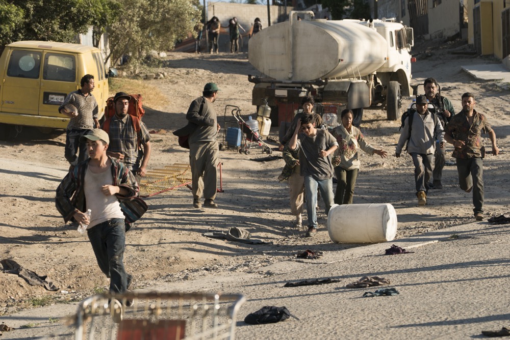 The Infected approach as people try to get water - Fear the Walking Dead _ Season 3, Episode 9 - Photo Credit: Richard Foreman, Jr/AMC